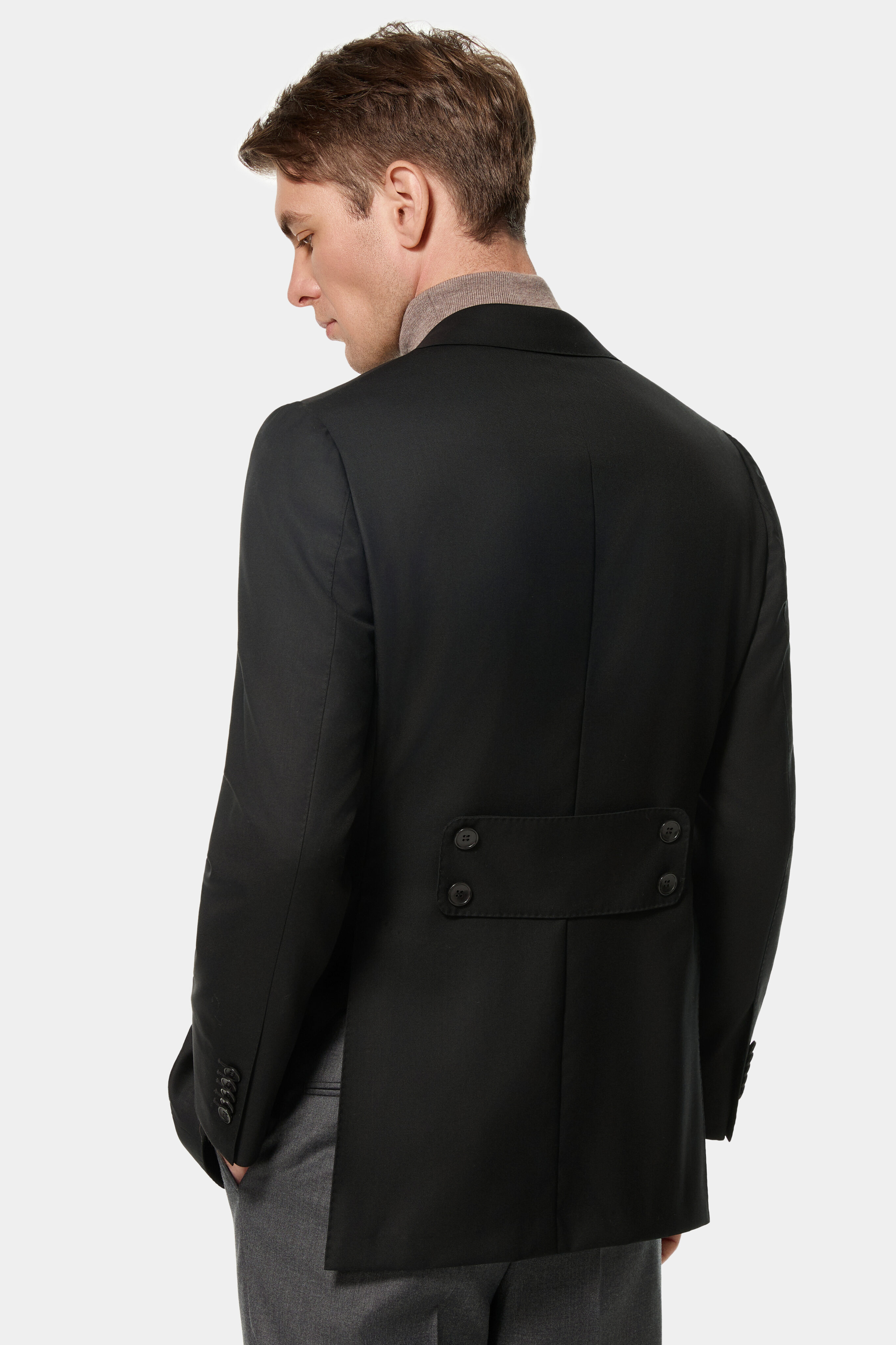 Black double-breasted jacket with back belt — back view.