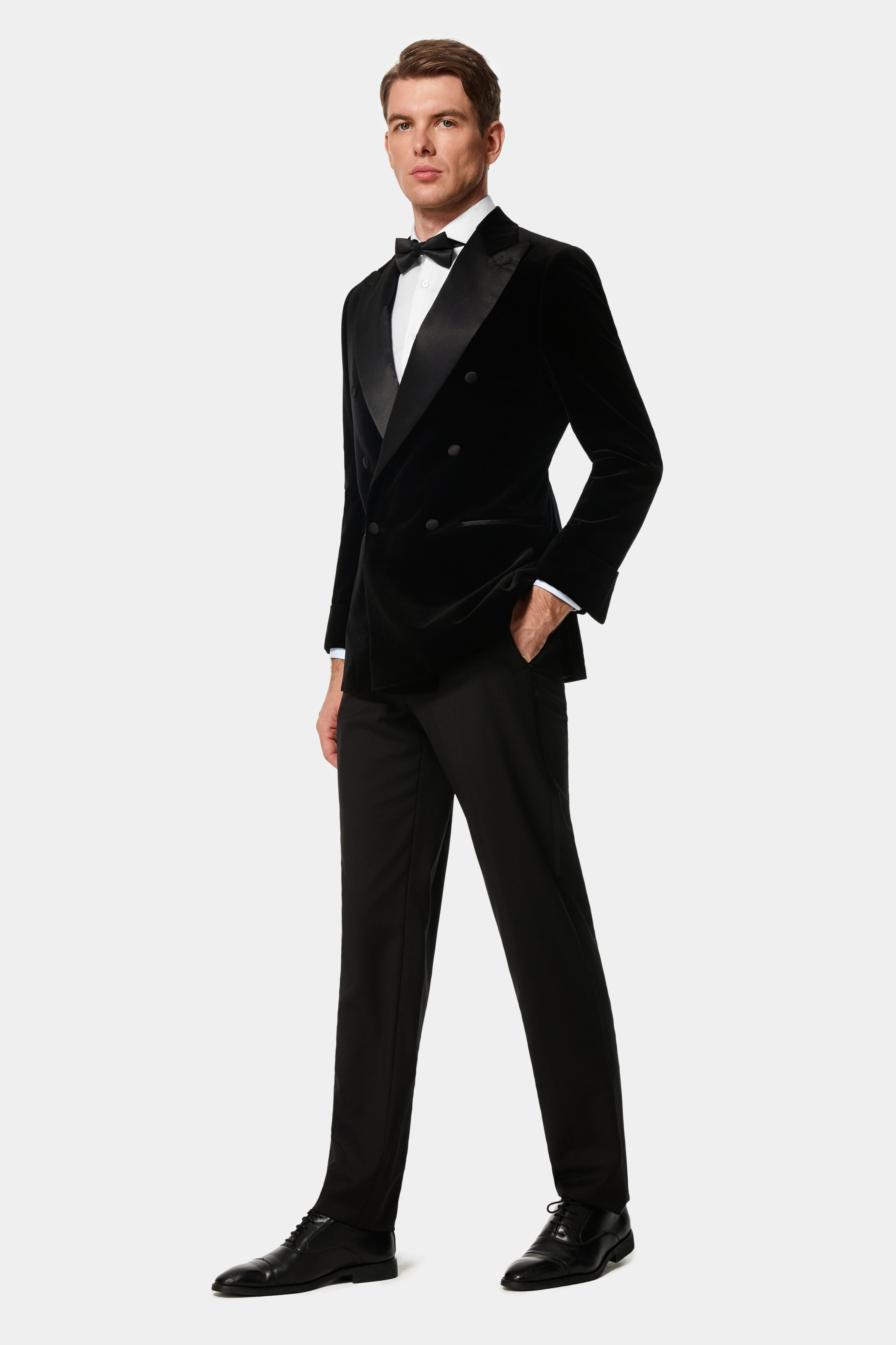 Black velvet double-breasted dinner jacket with silk peak lapels — front view.