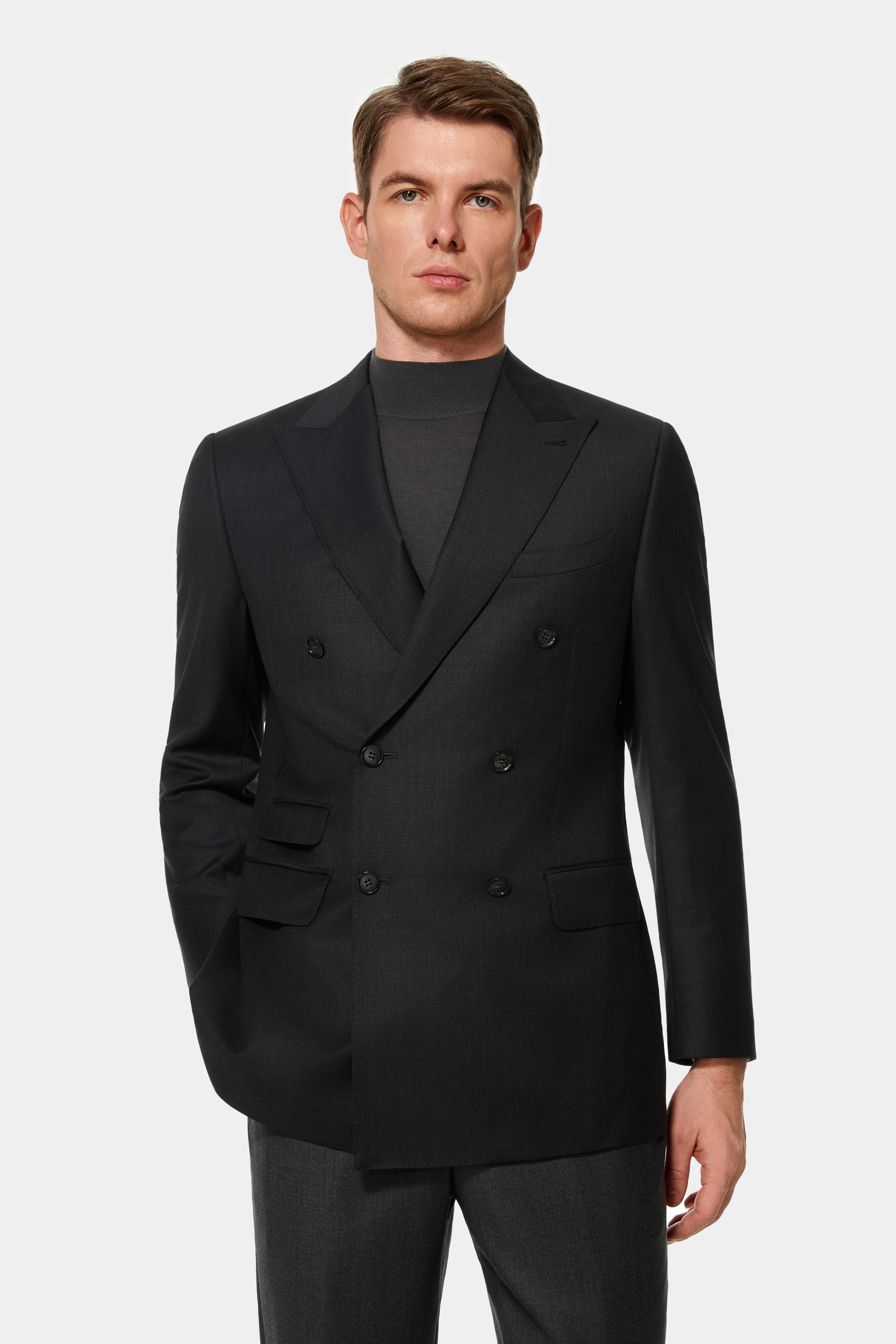 Charcoal double-breasted suit with peak lapels and 6×2 closure — front view.