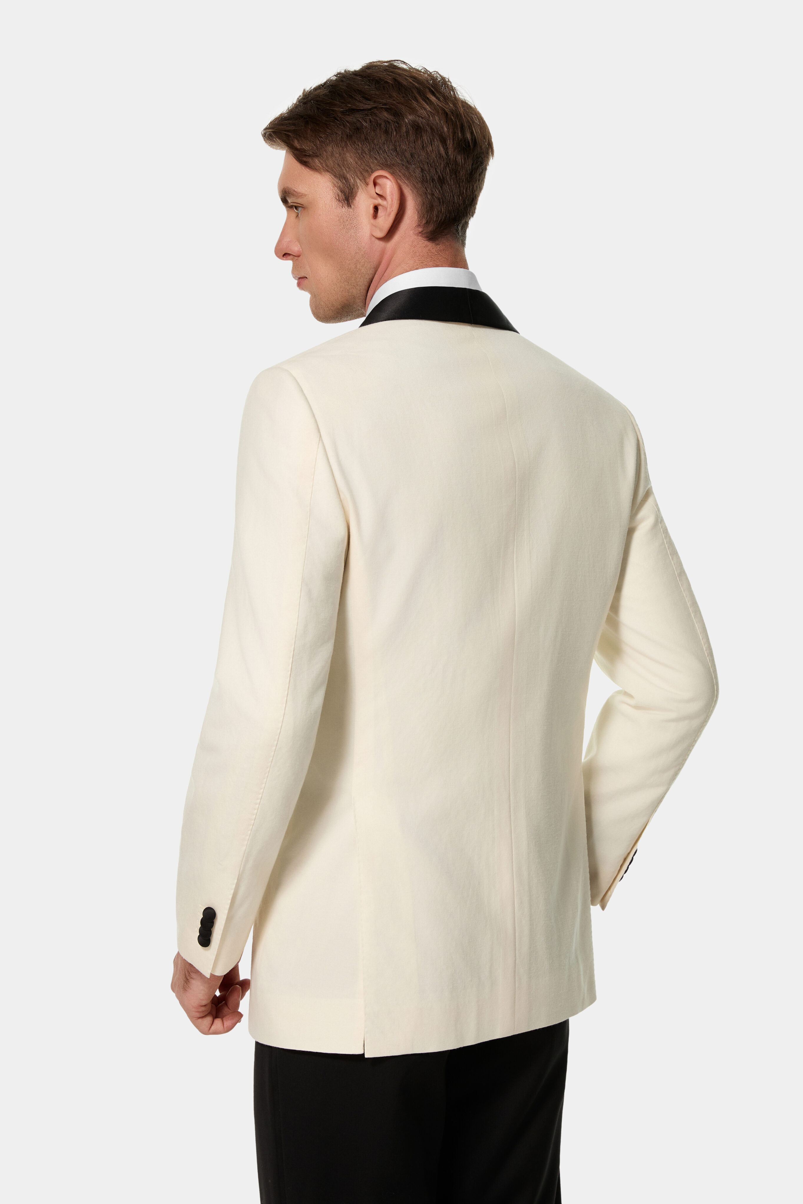 Ivory dinner jacket — back view with side vents.