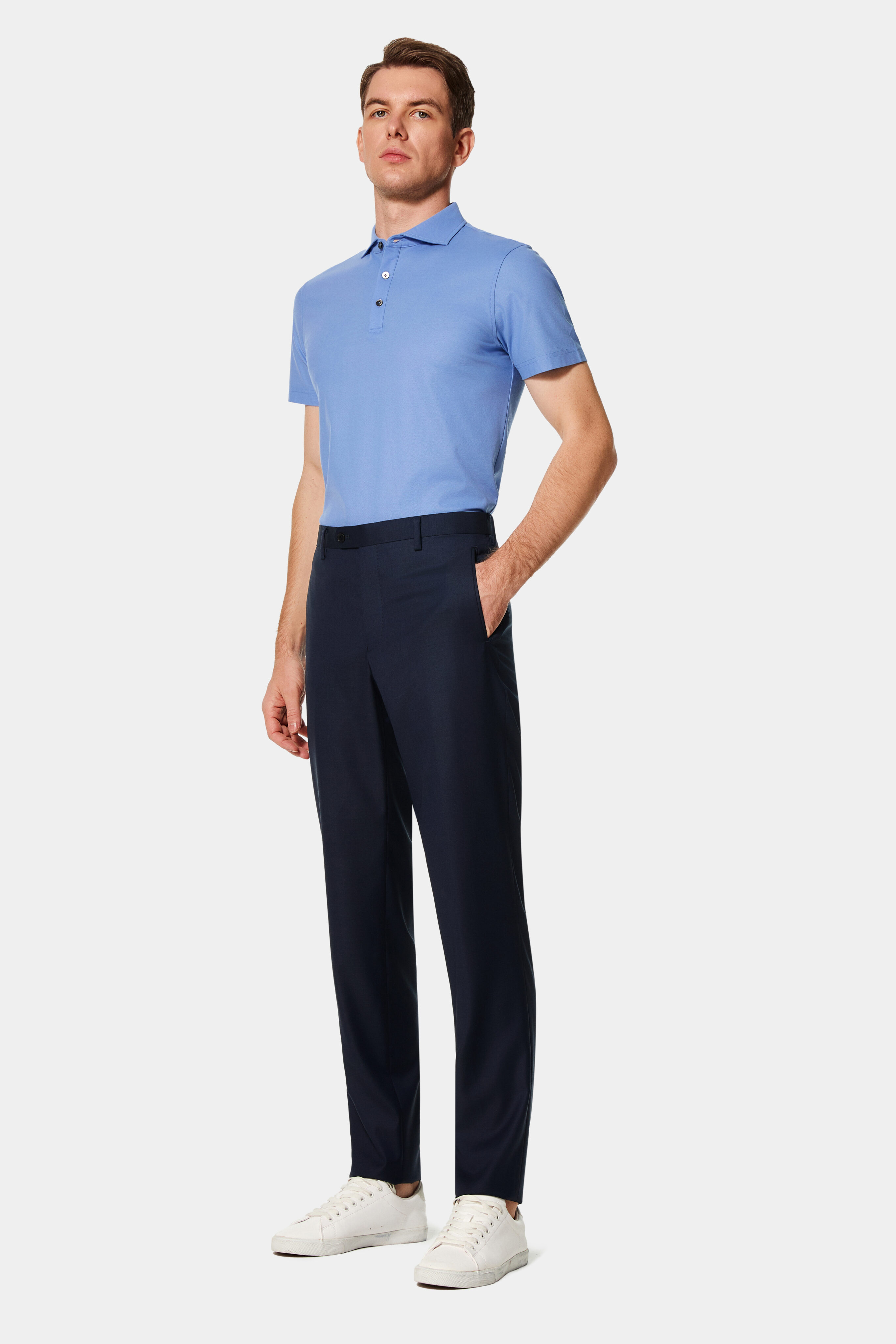 Navy Super 150’s flat-front trousers with belt loops — front view.
